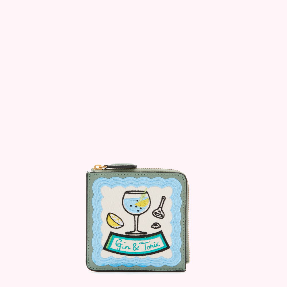 Sage green leather zip-around wallet with embroidered light blue and teal gin and tonic design.