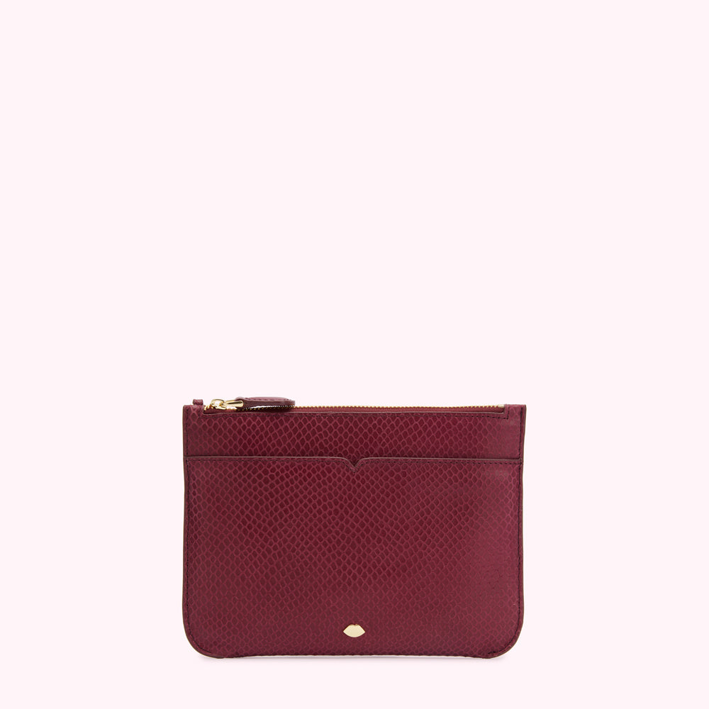 Burgundy snakeskin-textured leather zip pouch on a white background.
