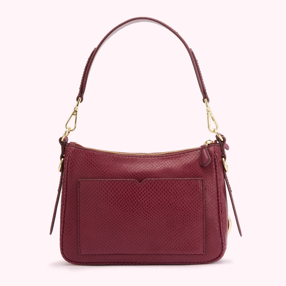 Burgundy snakeskin-embossed leather shoulder bag with gold-tone hardware.
