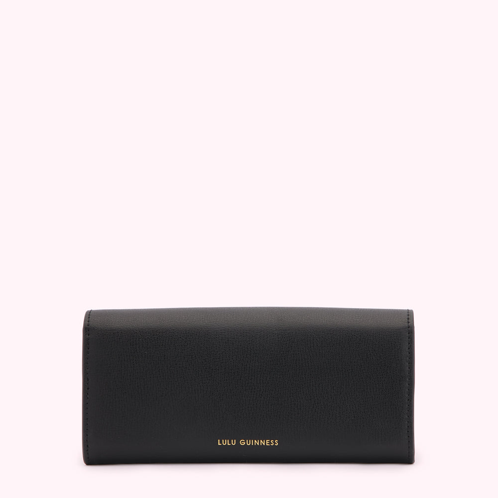 Black Lulu Guinness wallet against a white background.
