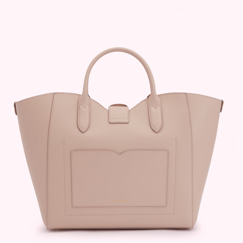 A pale pink leather tote bag with a front pocket and two top handles.