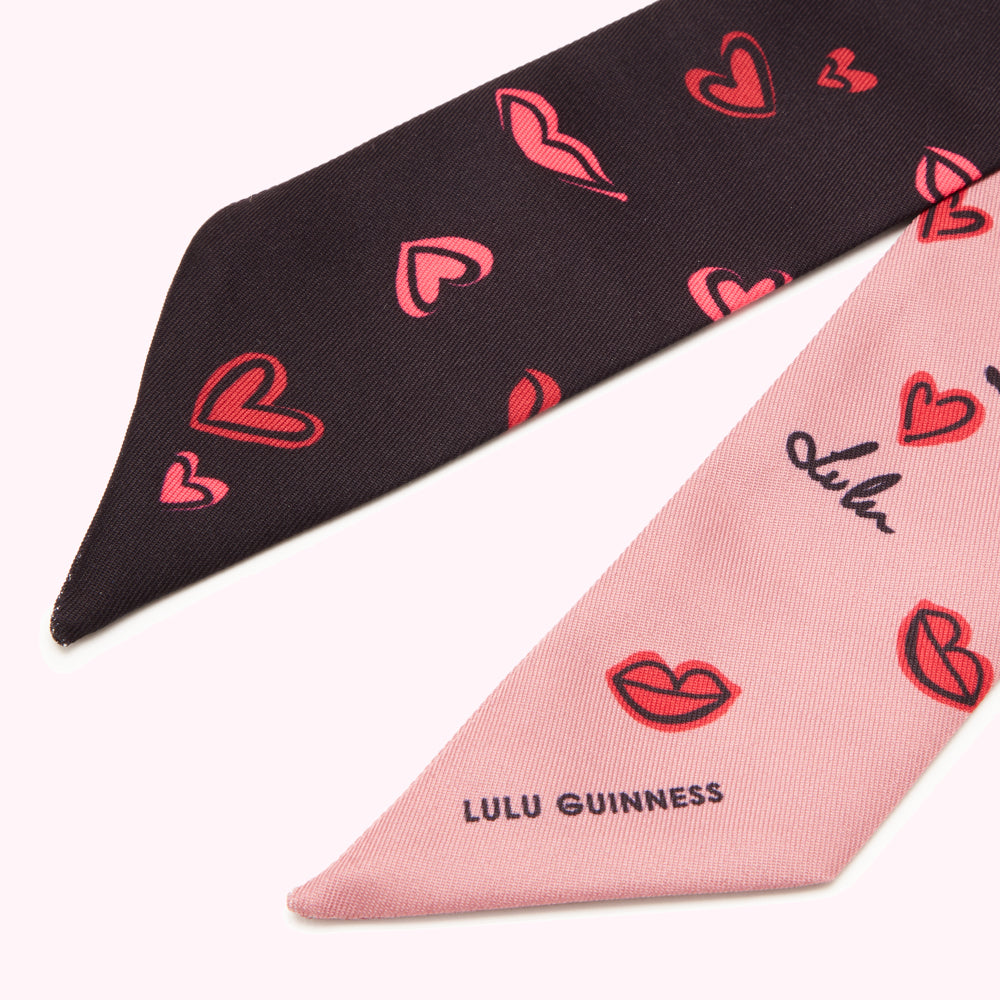 Double-sided Lulu Guinness scarf featuring a pink and black design with lips and hearts.