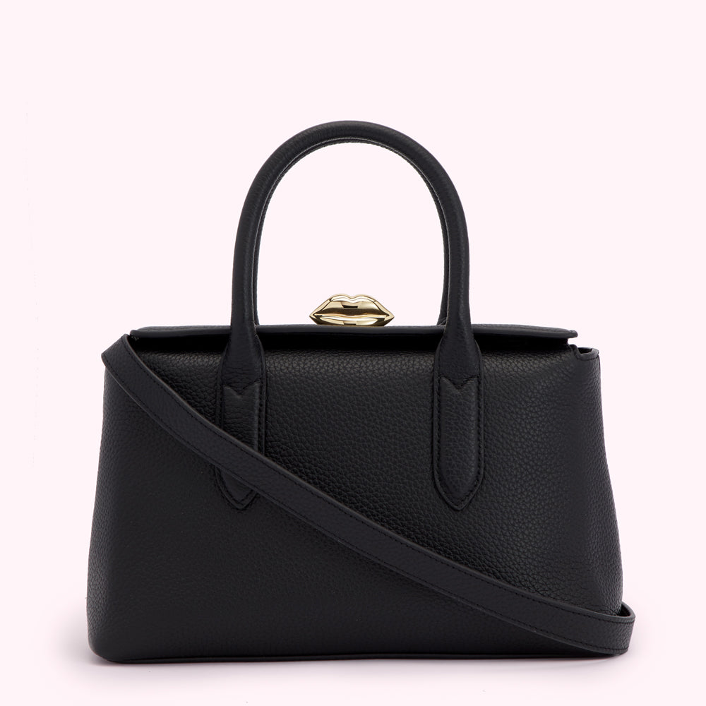 Black leather handbag with gold lip-shaped clasp and detachable shoulder strap.
