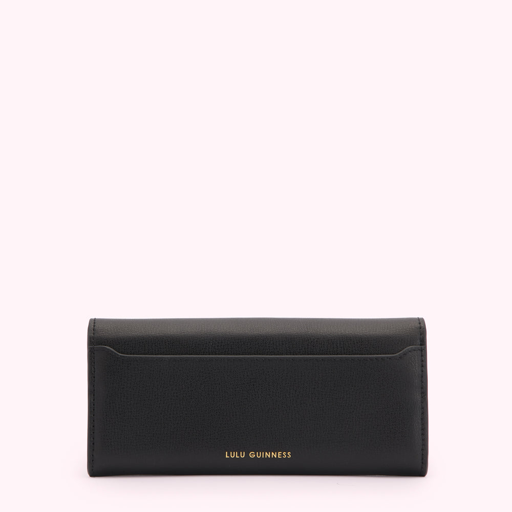 Black Lulu Guinness wallet on white background.
