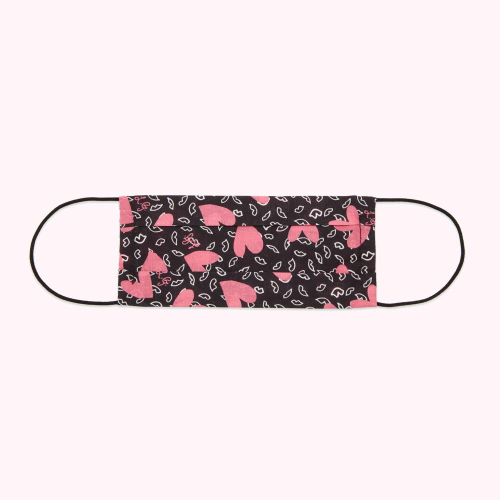 Black face mask with pink hearts and lips pattern.