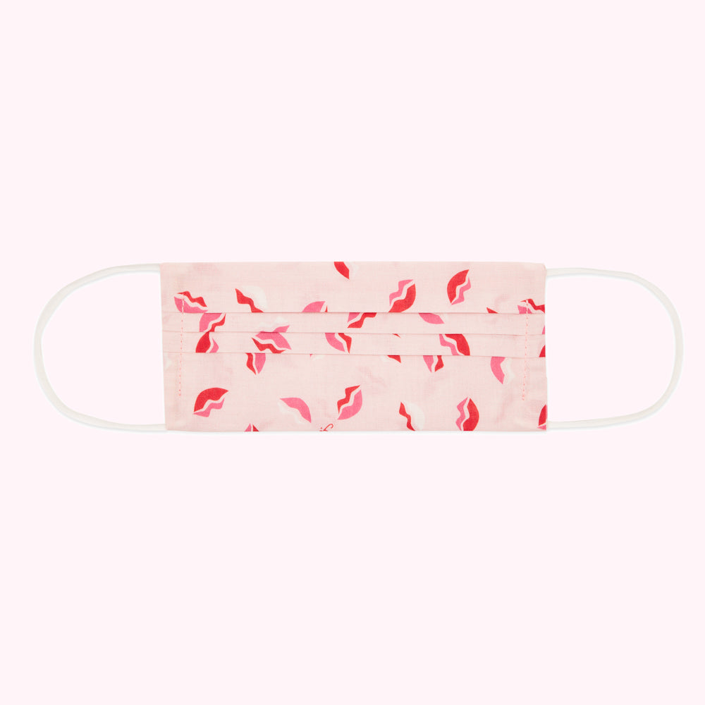 Pink face mask with red lips pattern.

