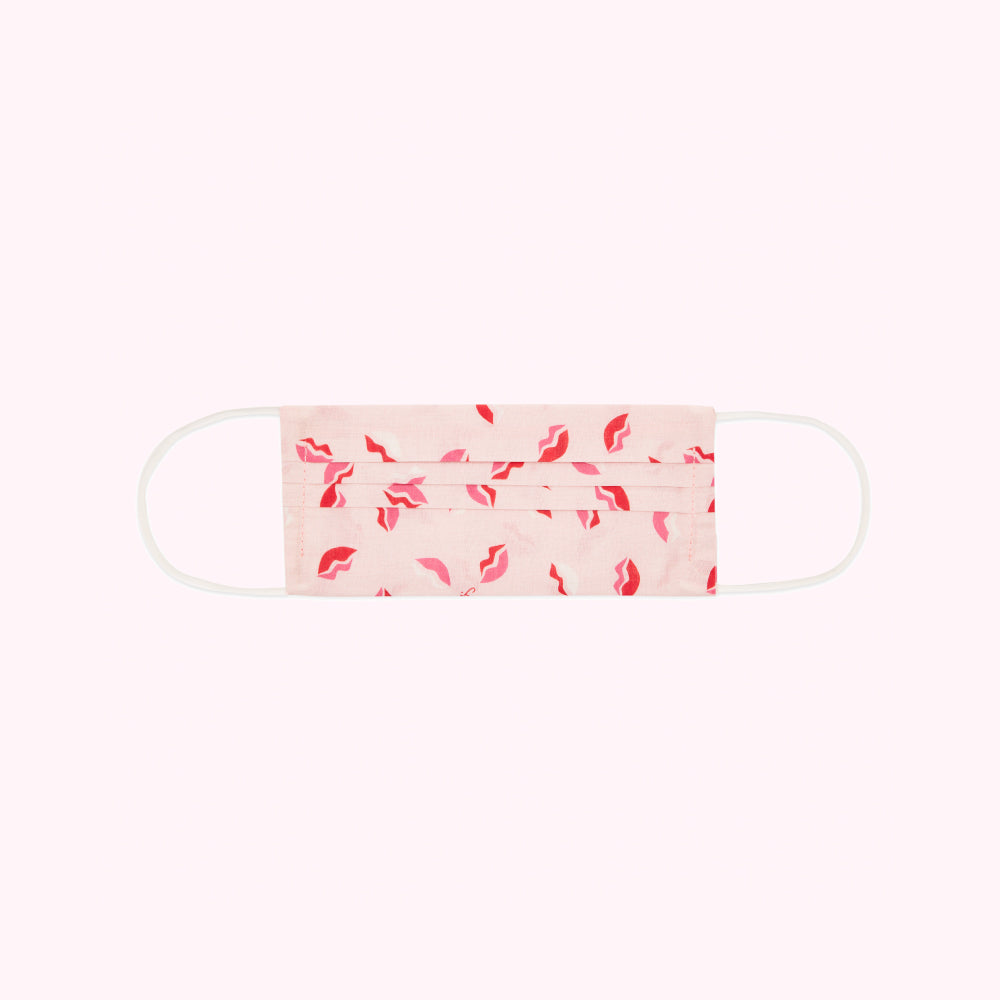 Pink face mask with red lips print.