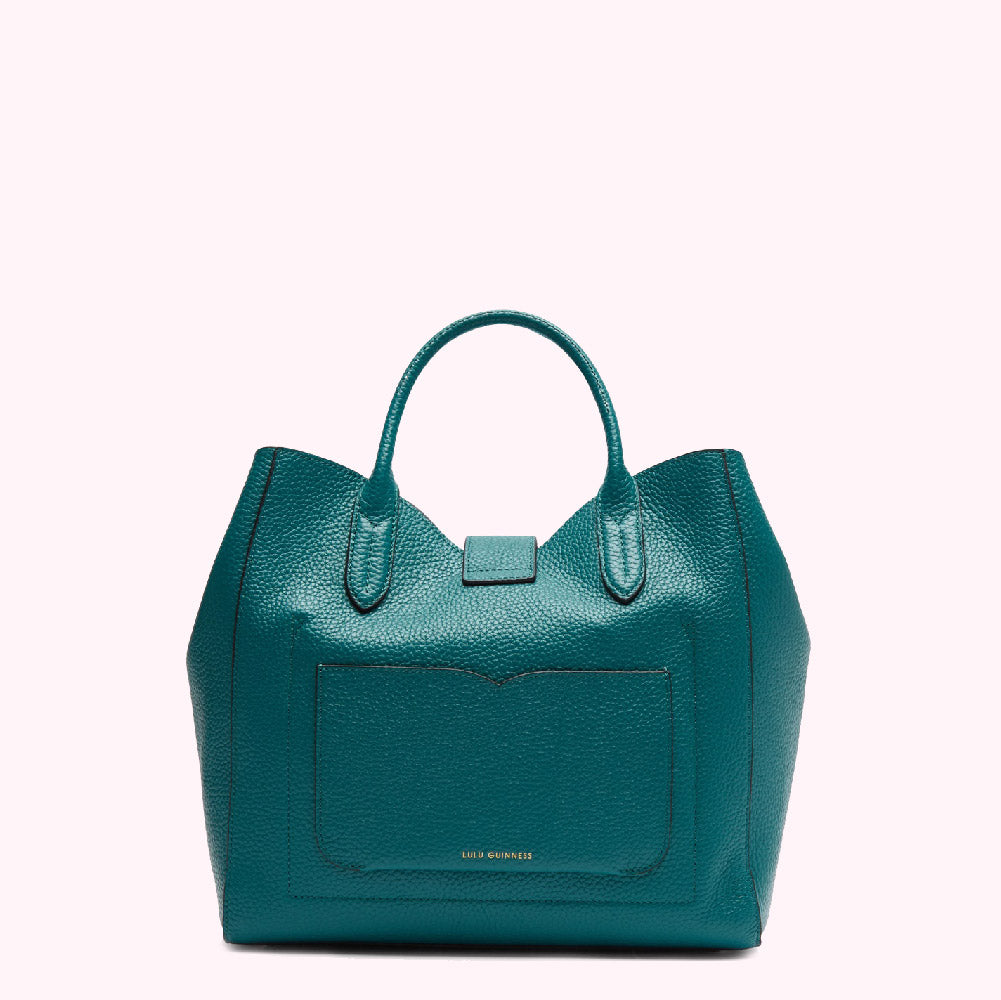 Teal leather tote bag with a front pocket and gold logo.
