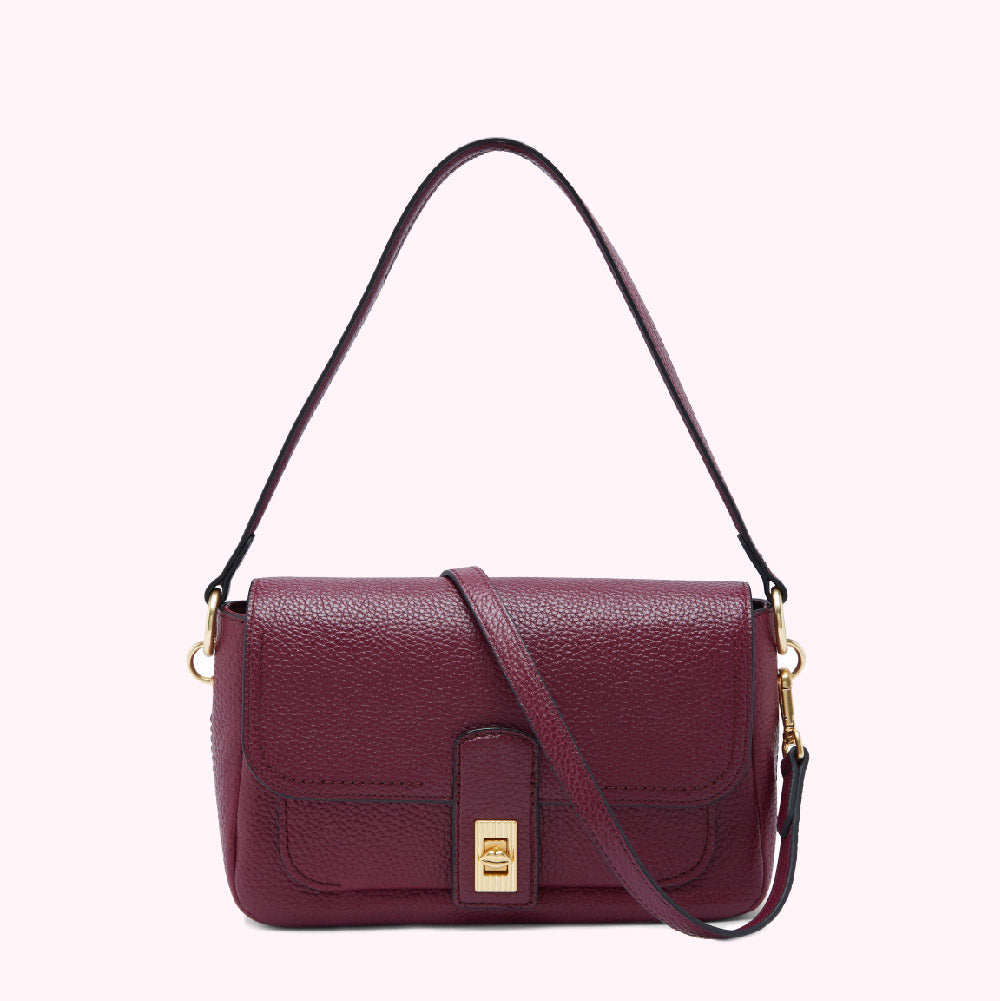 Burgundy leather crossbody bag with gold clasp.
