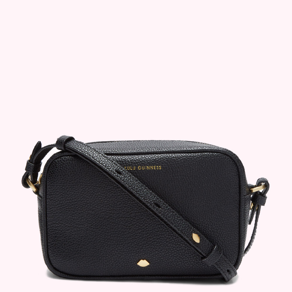 Black Lulu Guinness crossbody bag with gold hardware.
