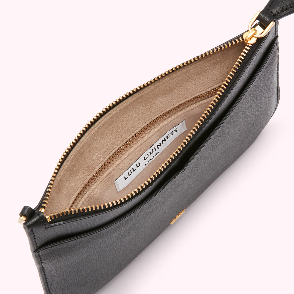 Open black Lulu Guinness zip pouch with beige interior.
