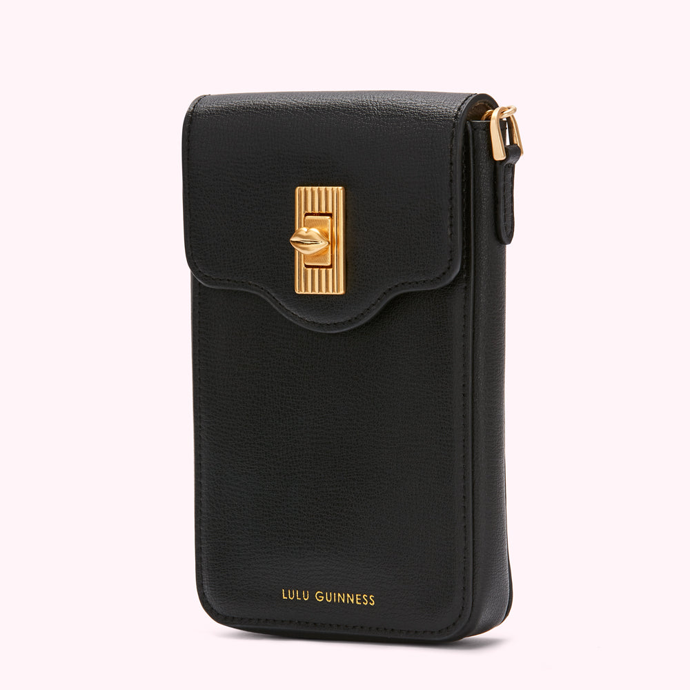 Black Lulu Guinness crossbody phone bag with gold clasp.
