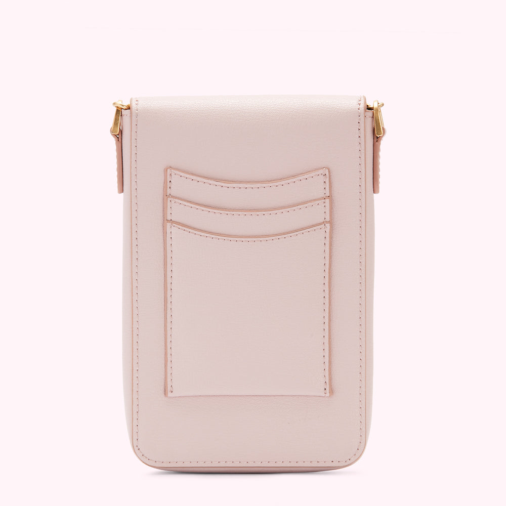 Back view of a pale pink leather crossbody phone bag with card slots.
