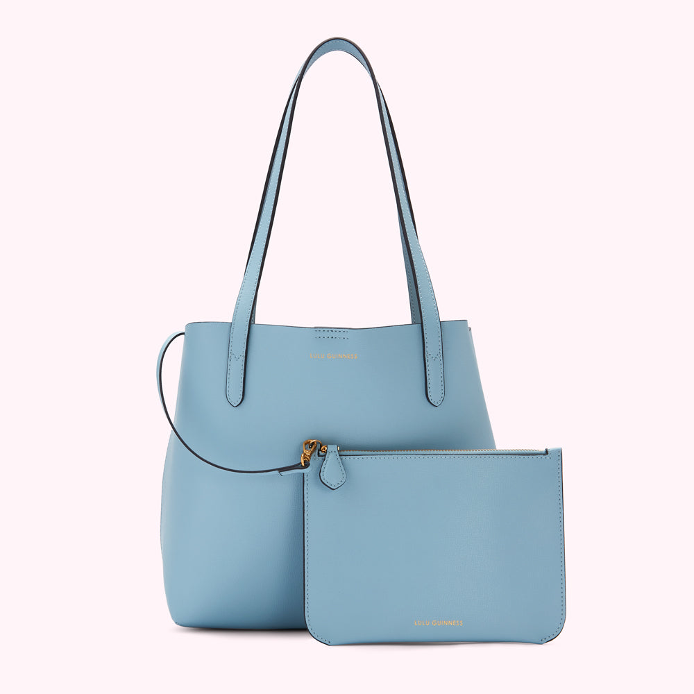 Light blue tote bag and matching pouch by Lulu Guinness.