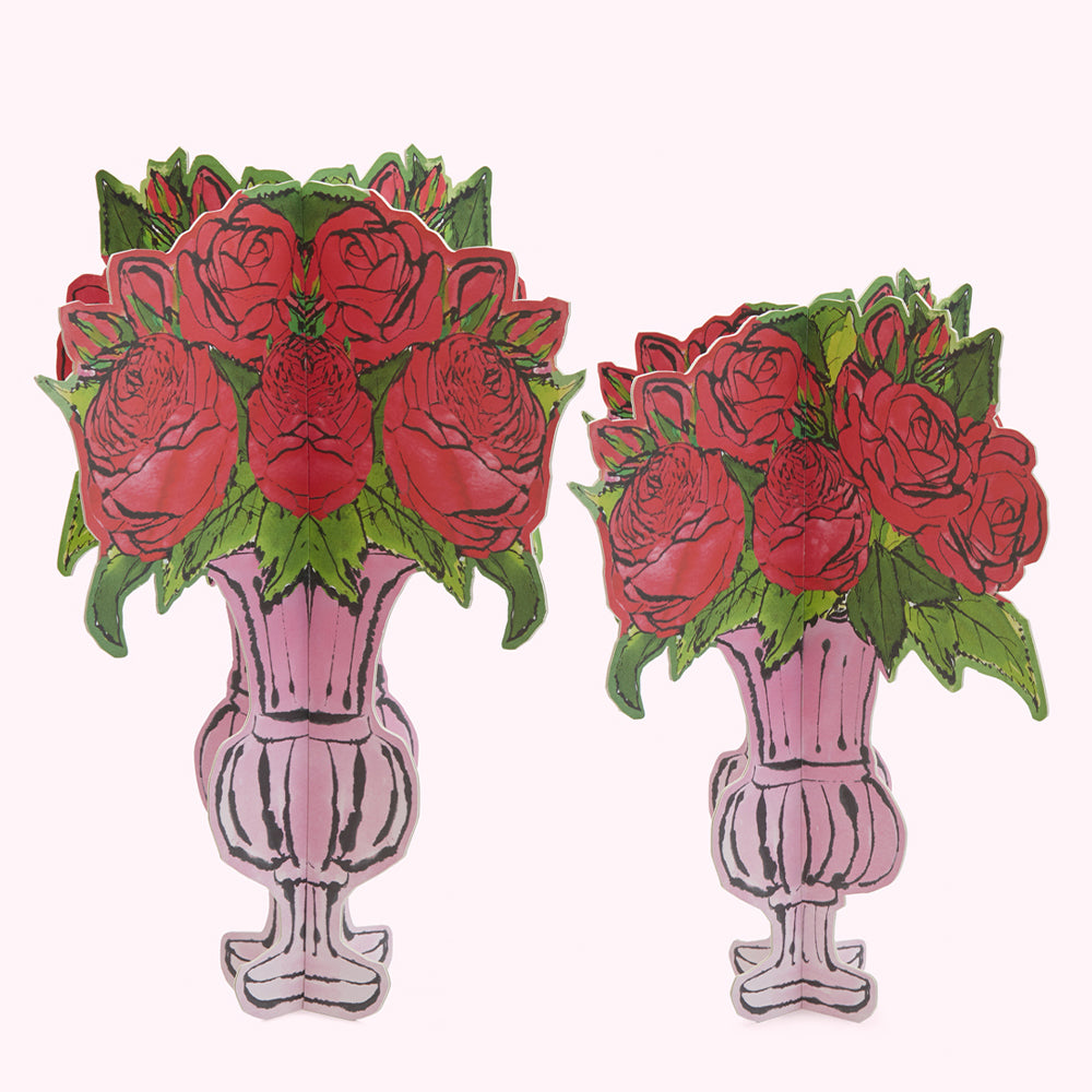 Image of two pink vases filled with red roses, the image is likely a cutout or card.