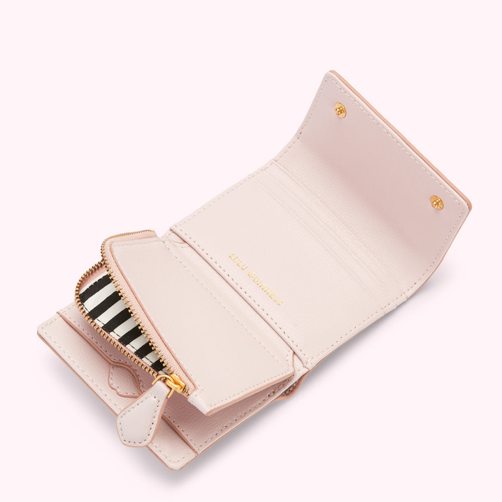 Pink leather wallet open to reveal interior and zip detailing.