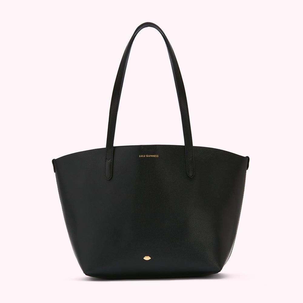 Black Lulu Guinness tote bag with gold logo.
