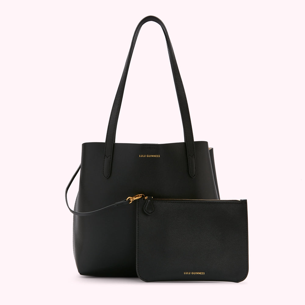 Black Lulu Guinness tote bag and matching pouch against a white background.
