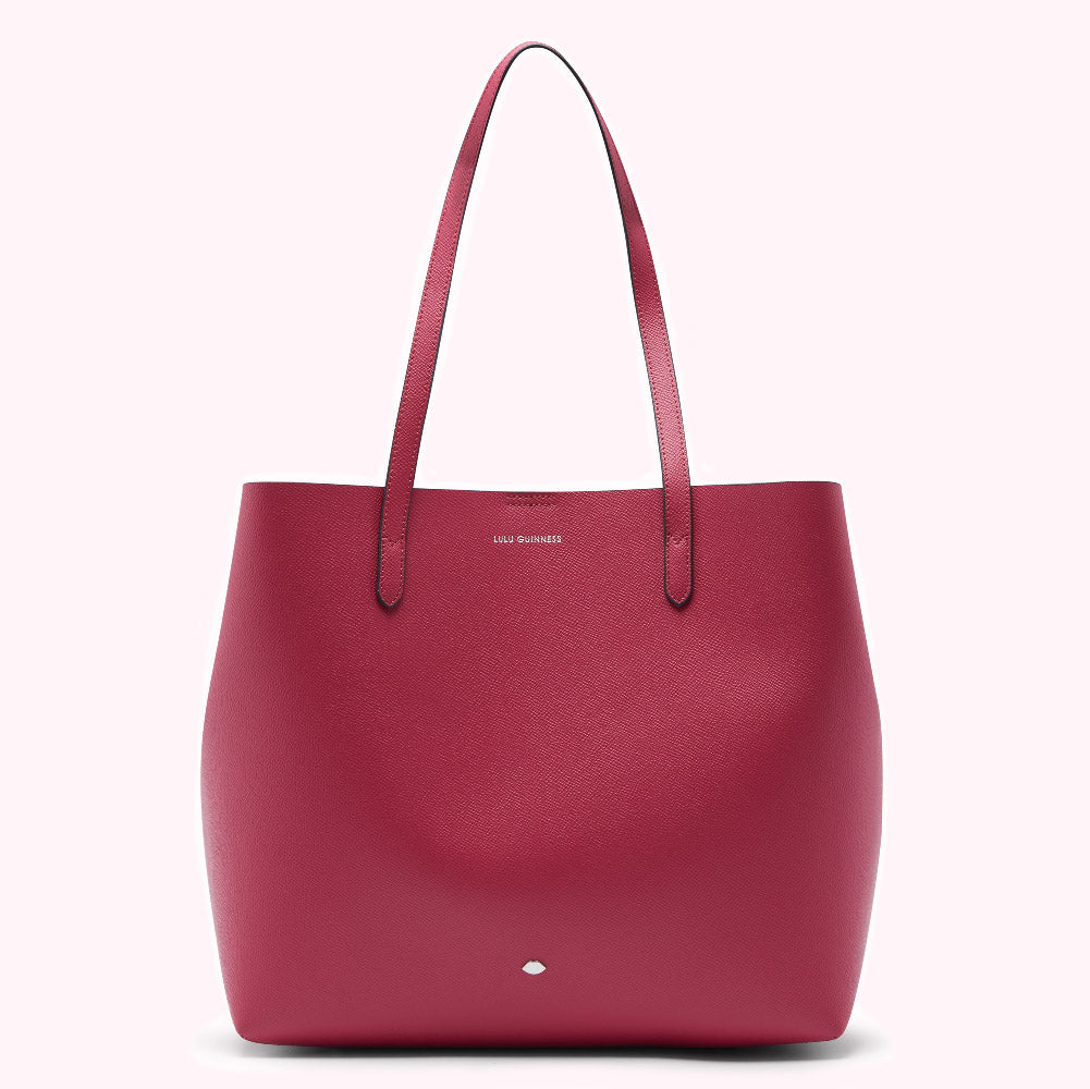 Crimson red Lulu Guinness tote bag on a white background.