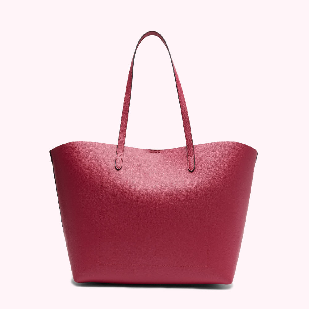 A crimson tote bag with black handles against a white background.
