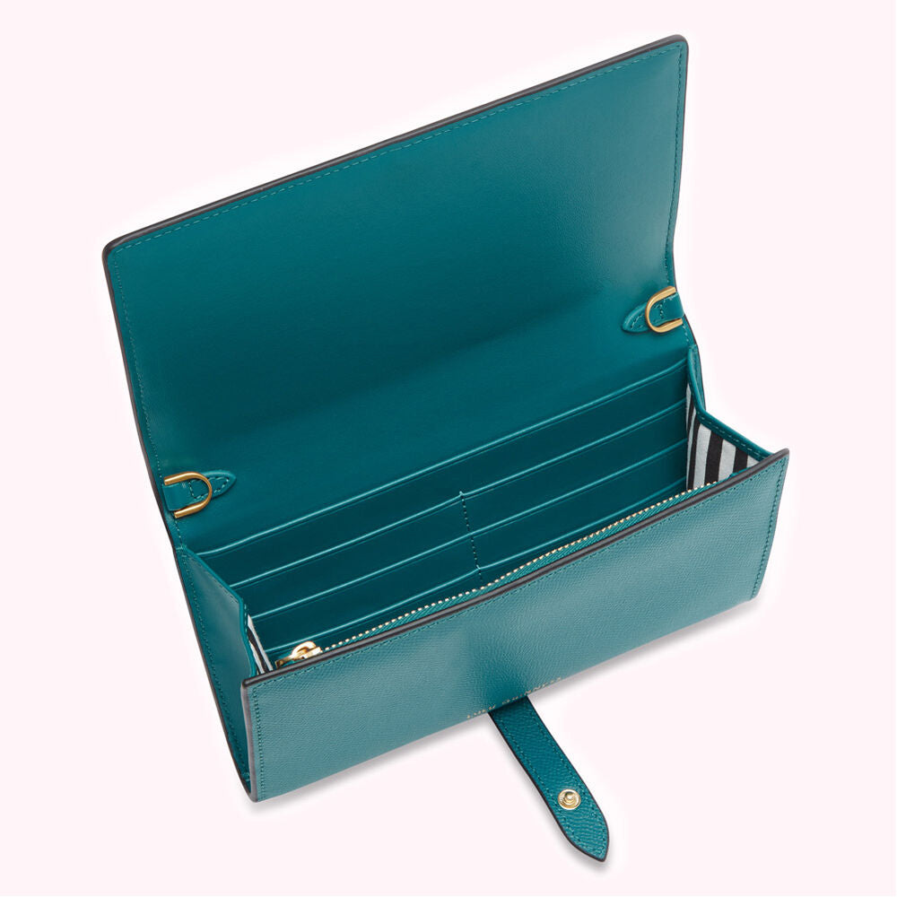 Teal leather wallet open to show interior card slots and zippered compartment.