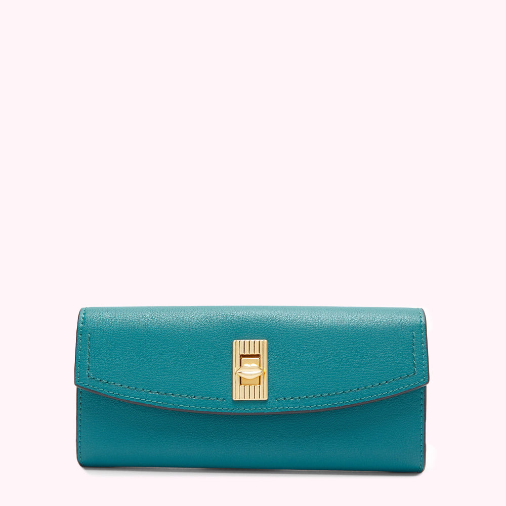 Teal leather wallet with gold clasp against a white background.
