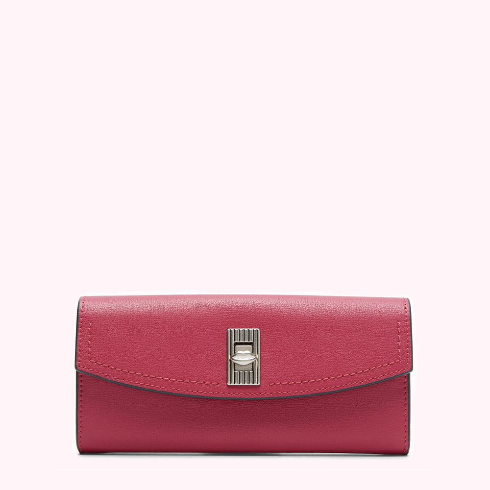 A crimson leather wallet with a silver clasp against a white background.
