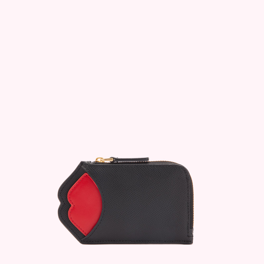 Black leather zip-around wallet with red lips detail on a white background.
