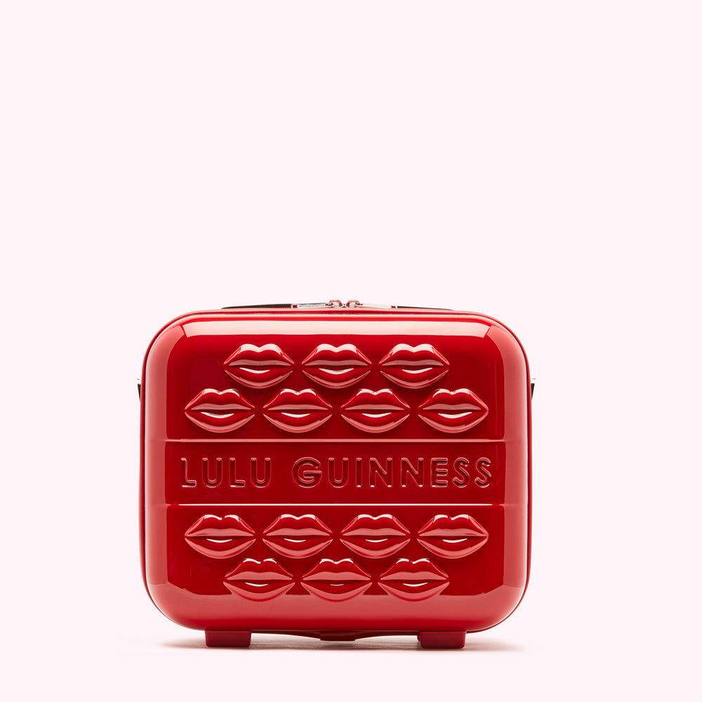 Red Lulu Guinness makeup case with lips design.