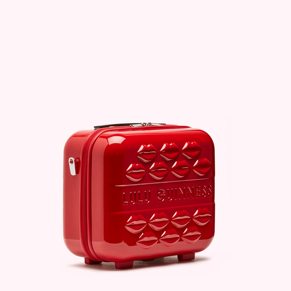 Red Lulu Guinness makeup case with embossed lips.

