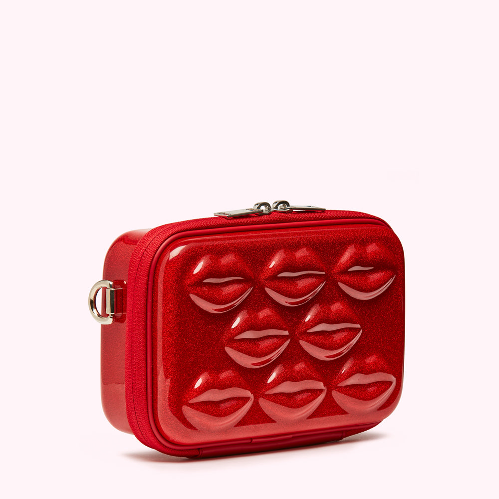 Red glitter crossbody bag with molded lips.