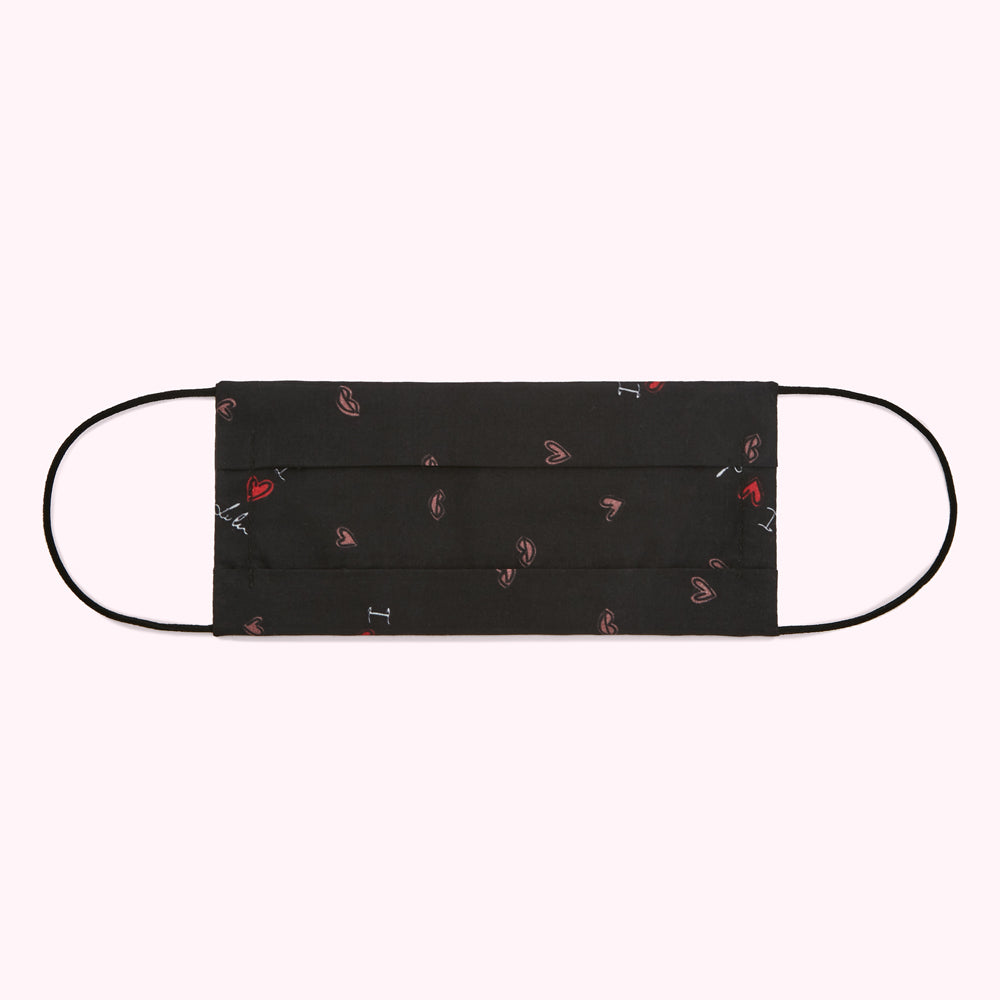 Black face mask with a pattern of red lips and hearts.
