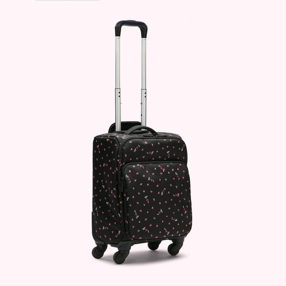 Black carry-on suitcase with a repeating pattern of pink hearts and "I love lulu" text on a white background.