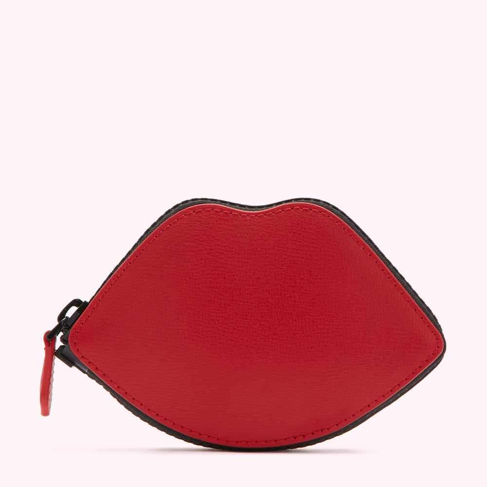 Red leather lip-shaped coin purse with black zipper and trim.
