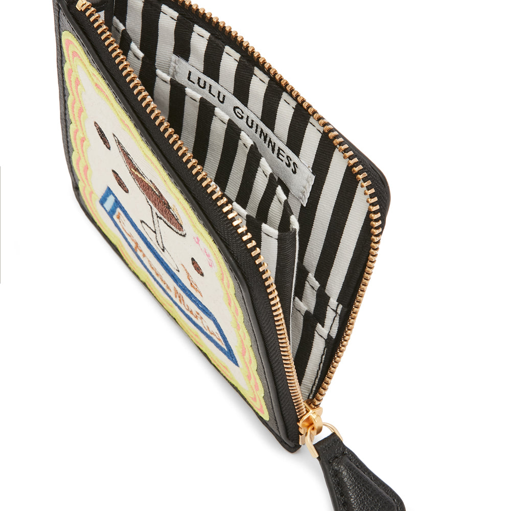 Open black Lulu Guinness zip-around wallet with colorful embroidered design.