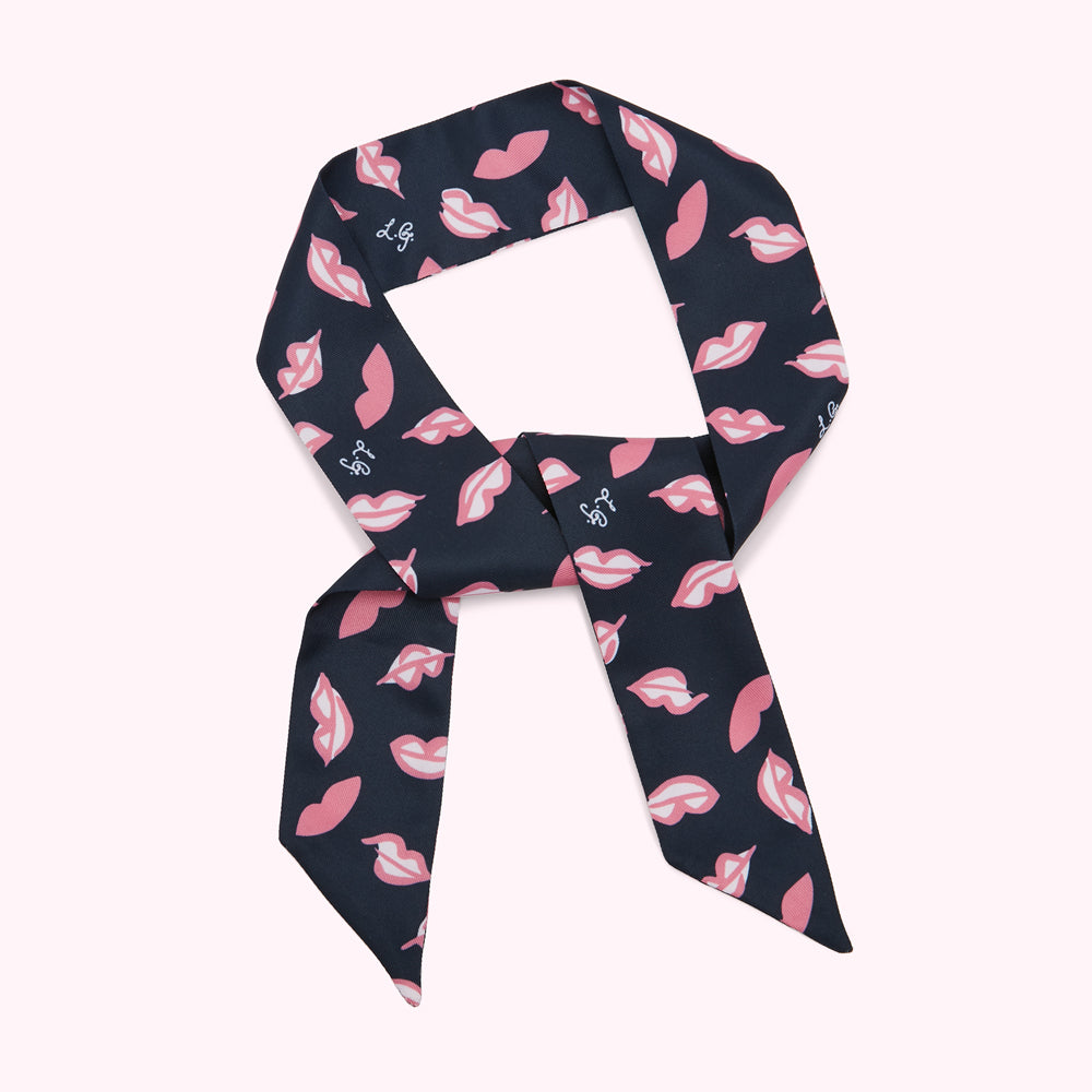 Navy blue silk scarf with pink lips print.