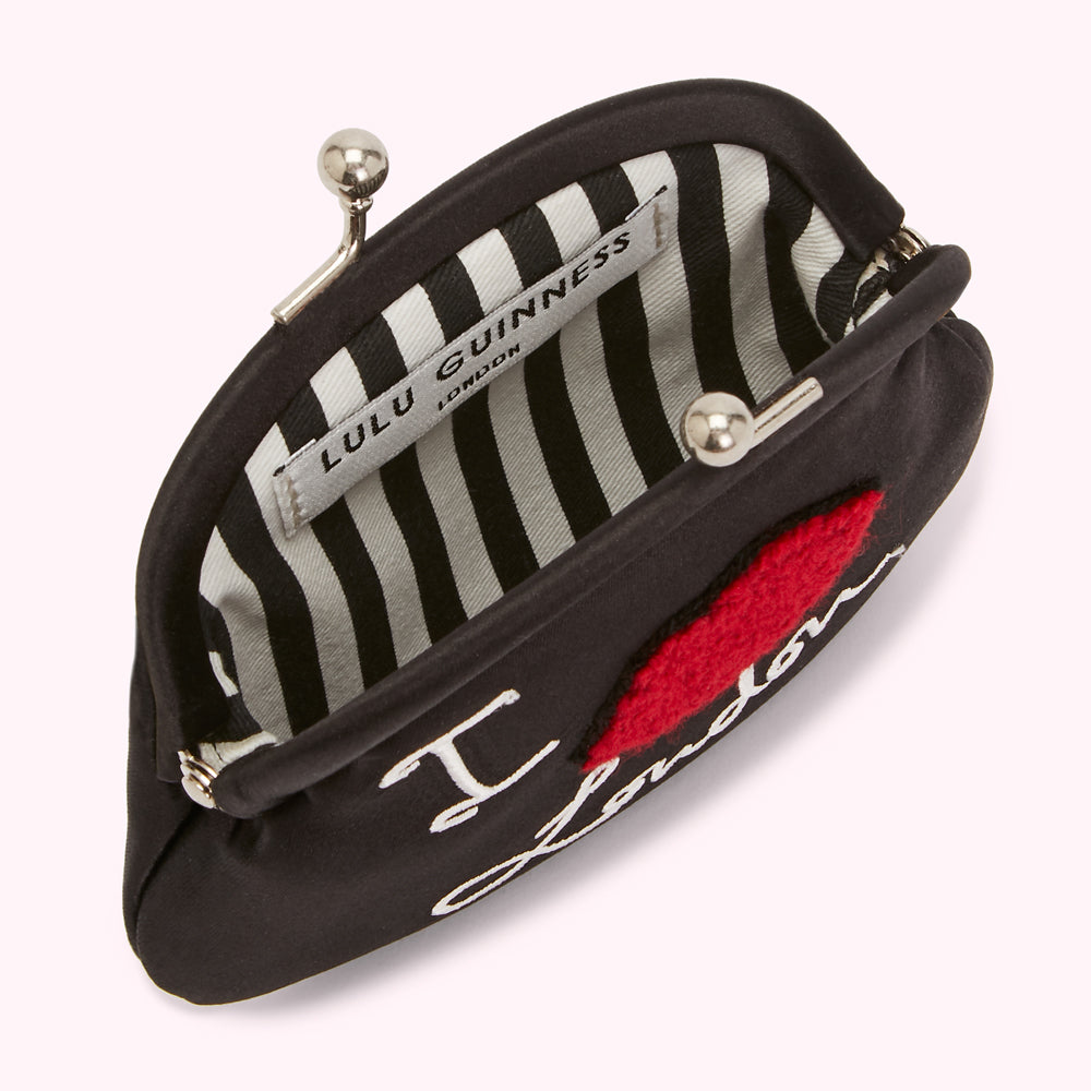 Black Lulu Guinness purse with embroidered "I love London" and a red felt heart.