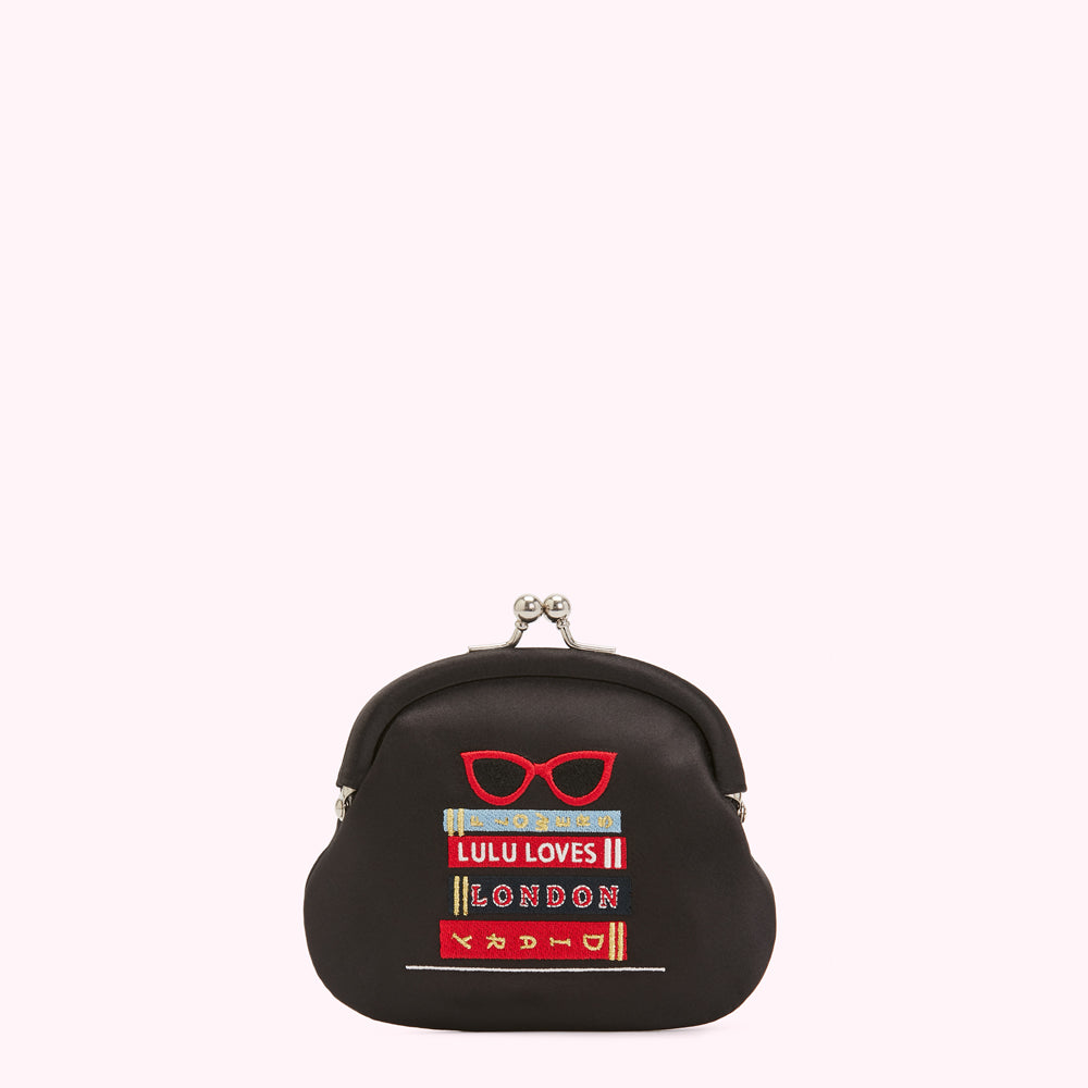 Black satin purse with embroidered glasses and books; text reads "Lulu Loves London".