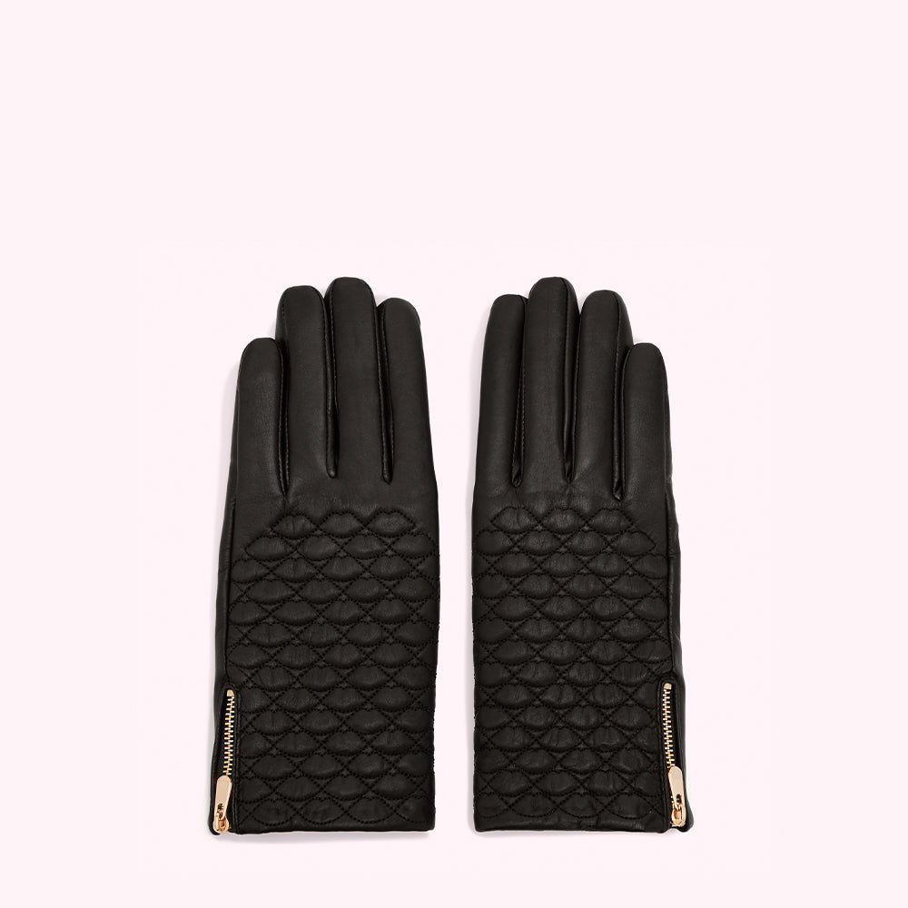 Pair of black quilted leather gloves with gold zippers.

