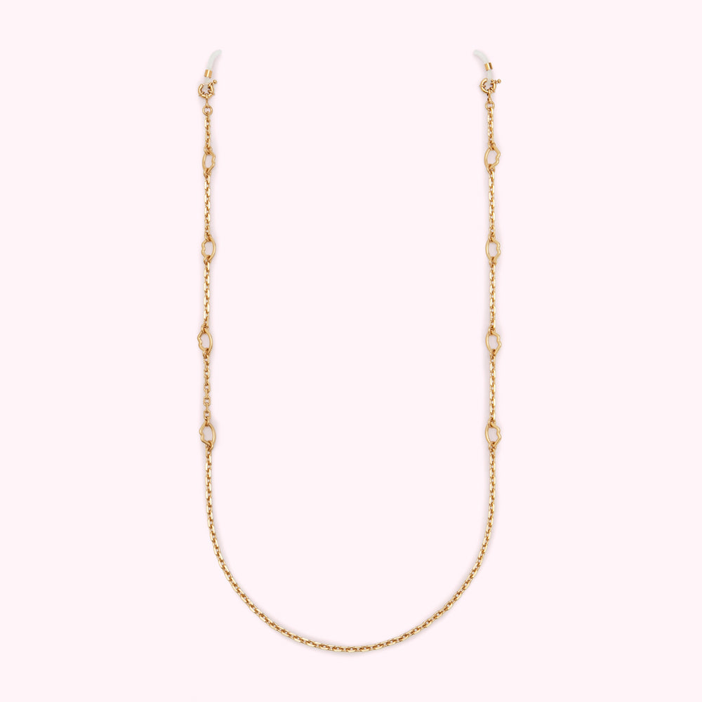 Gold eyeglasses chain with small decorative links against a white background.
