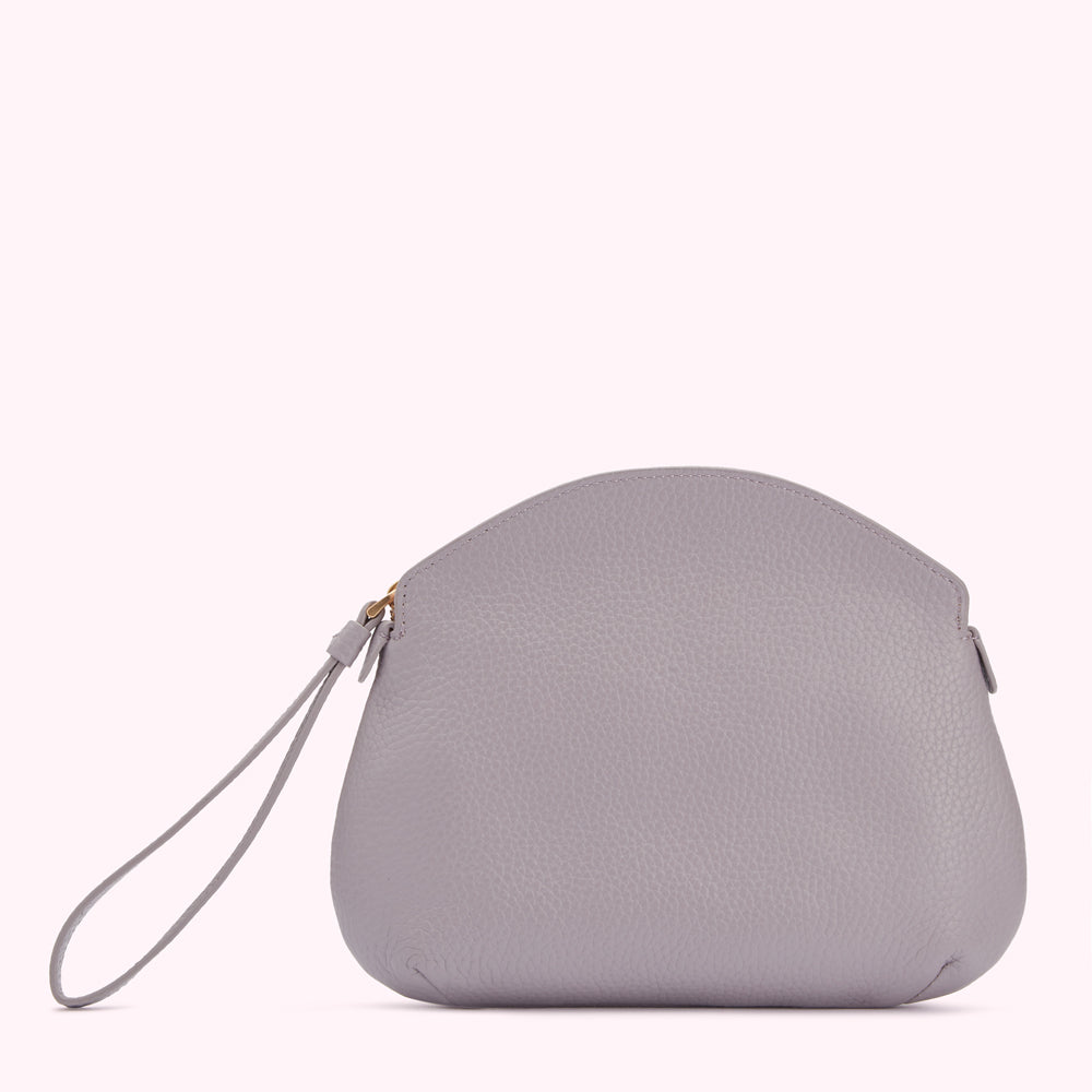 A light grey leather clutch with a wrist strap.