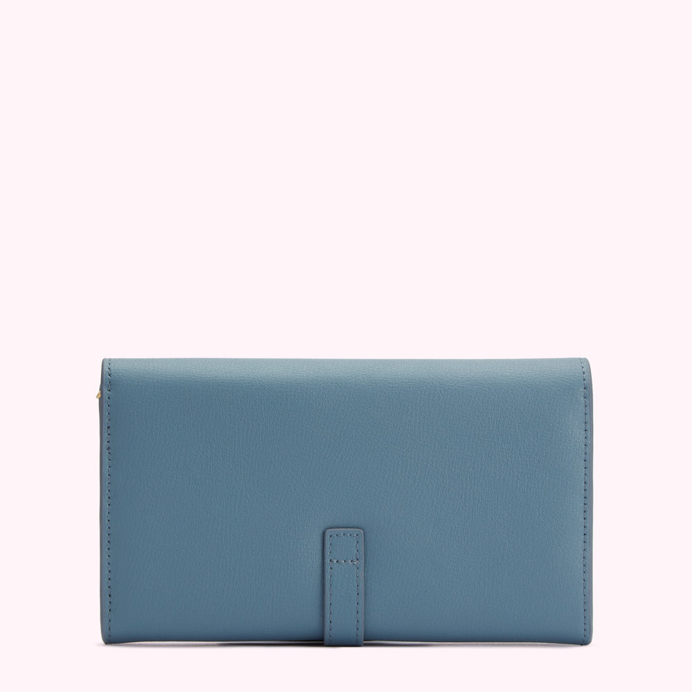 Dusty blue leather wallet with gold clasp.
