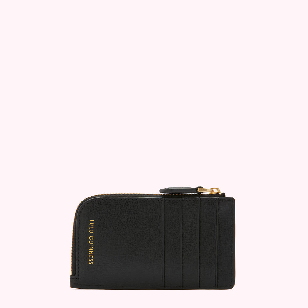 Black leather cardholder with gold zipper and Lulu Guinness logo.
