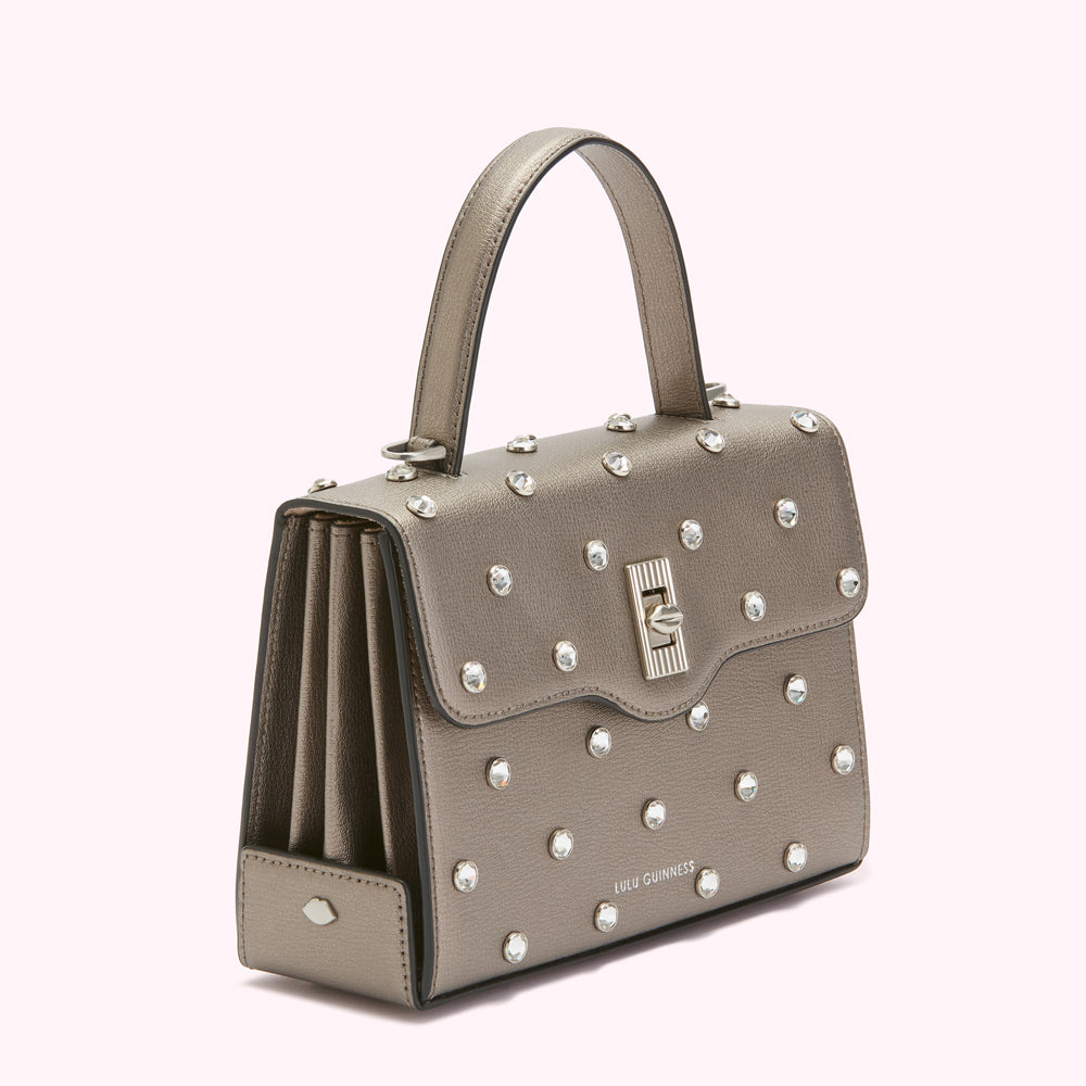 Silver Lulu Guinness metallic handbag with crystal embellishments.
