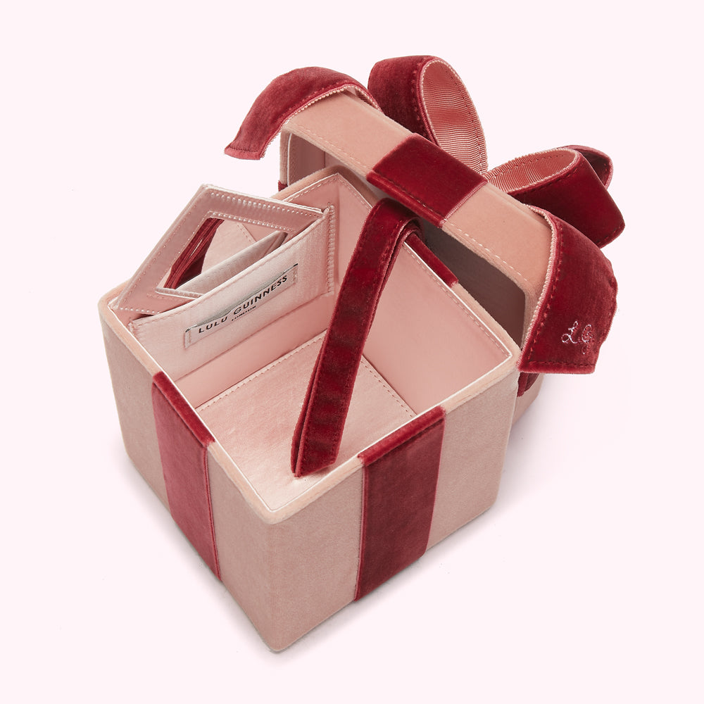 Open blush pink and burgundy velvet Lulu Guinness gift box bag with mirror.
