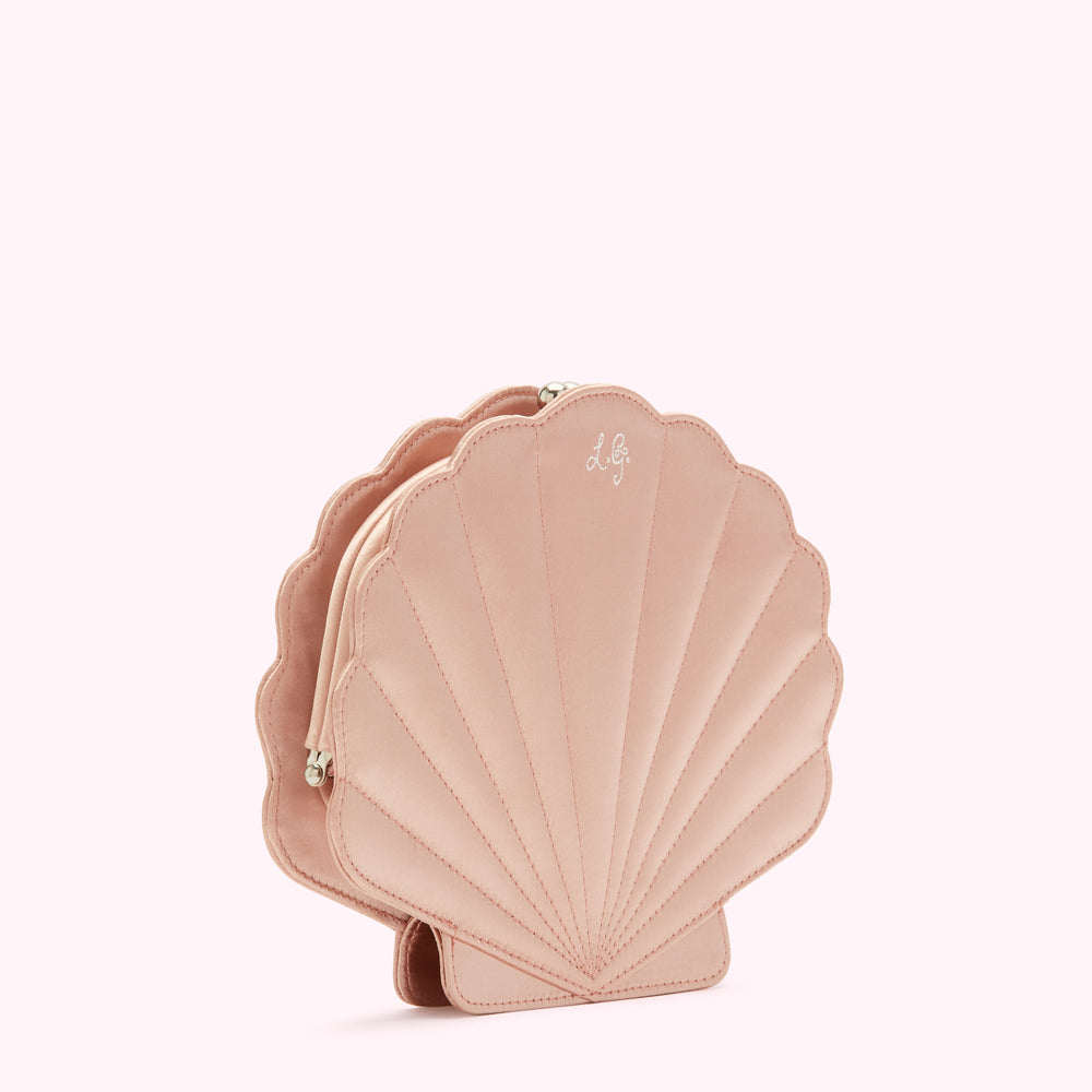 Pink satin seashell-shaped clutch.

