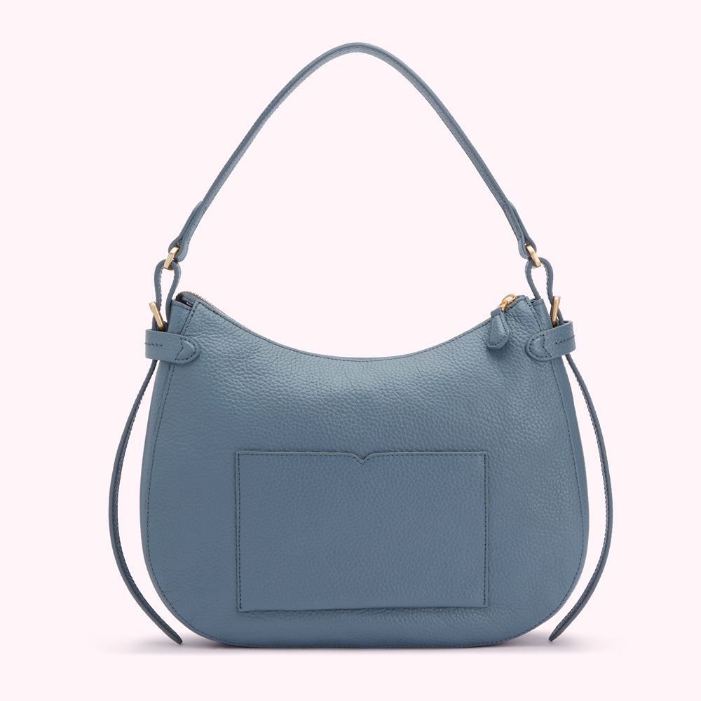 Dusty blue leather hobo handbag with gold-tone hardware and a back slip pocket.
