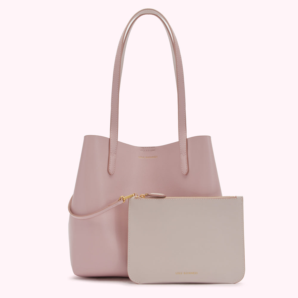 Pink Lulu Guinness tote bag and matching light beige pouch.
