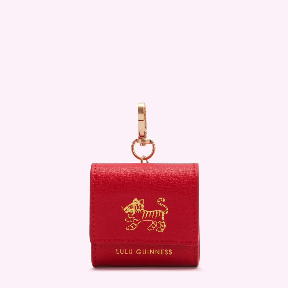 Red leather Lulu Guinness Air pod holder with gold tiger emblem and clasp.

