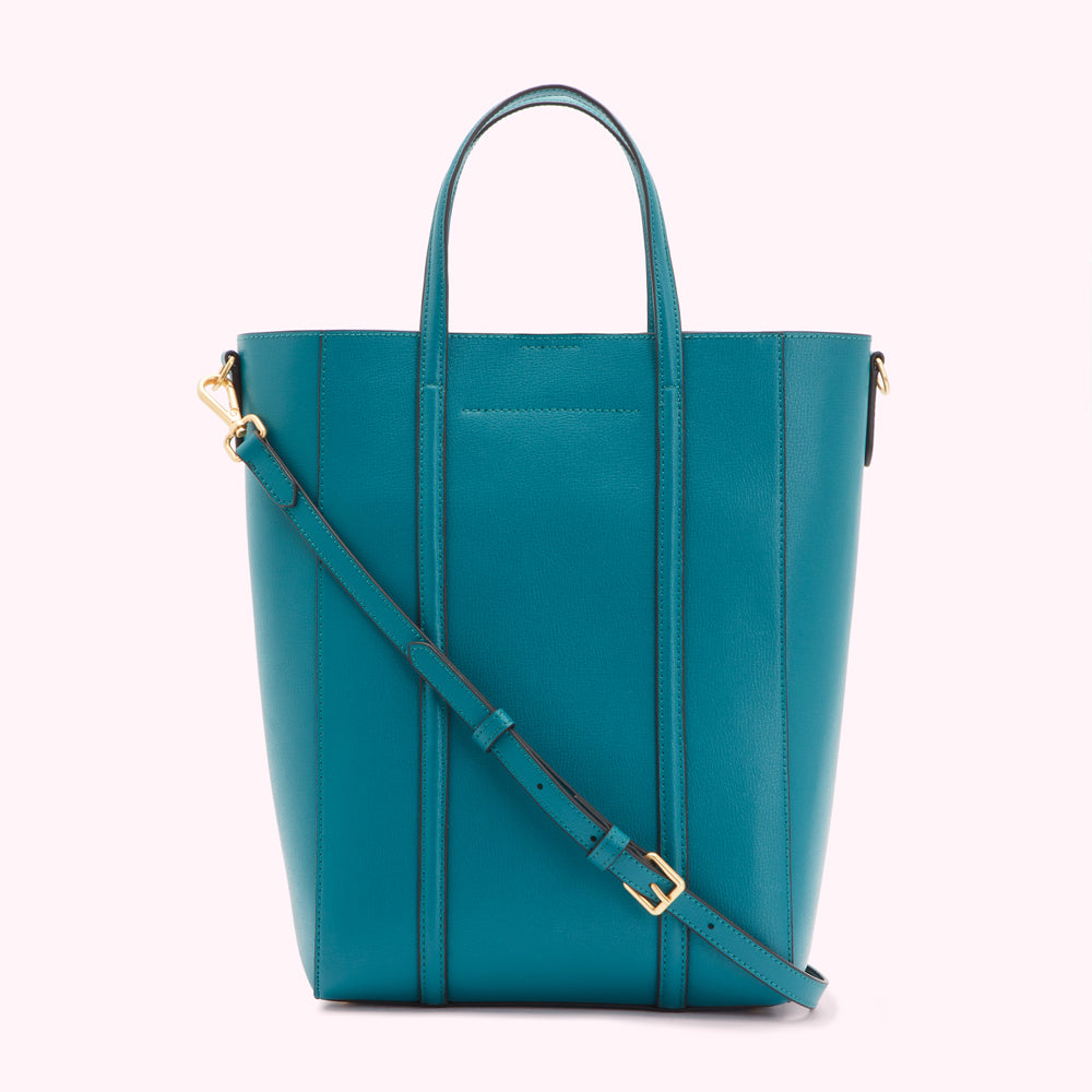 Teal leather tote bag with gold hardware and adjustable shoulder strap.
